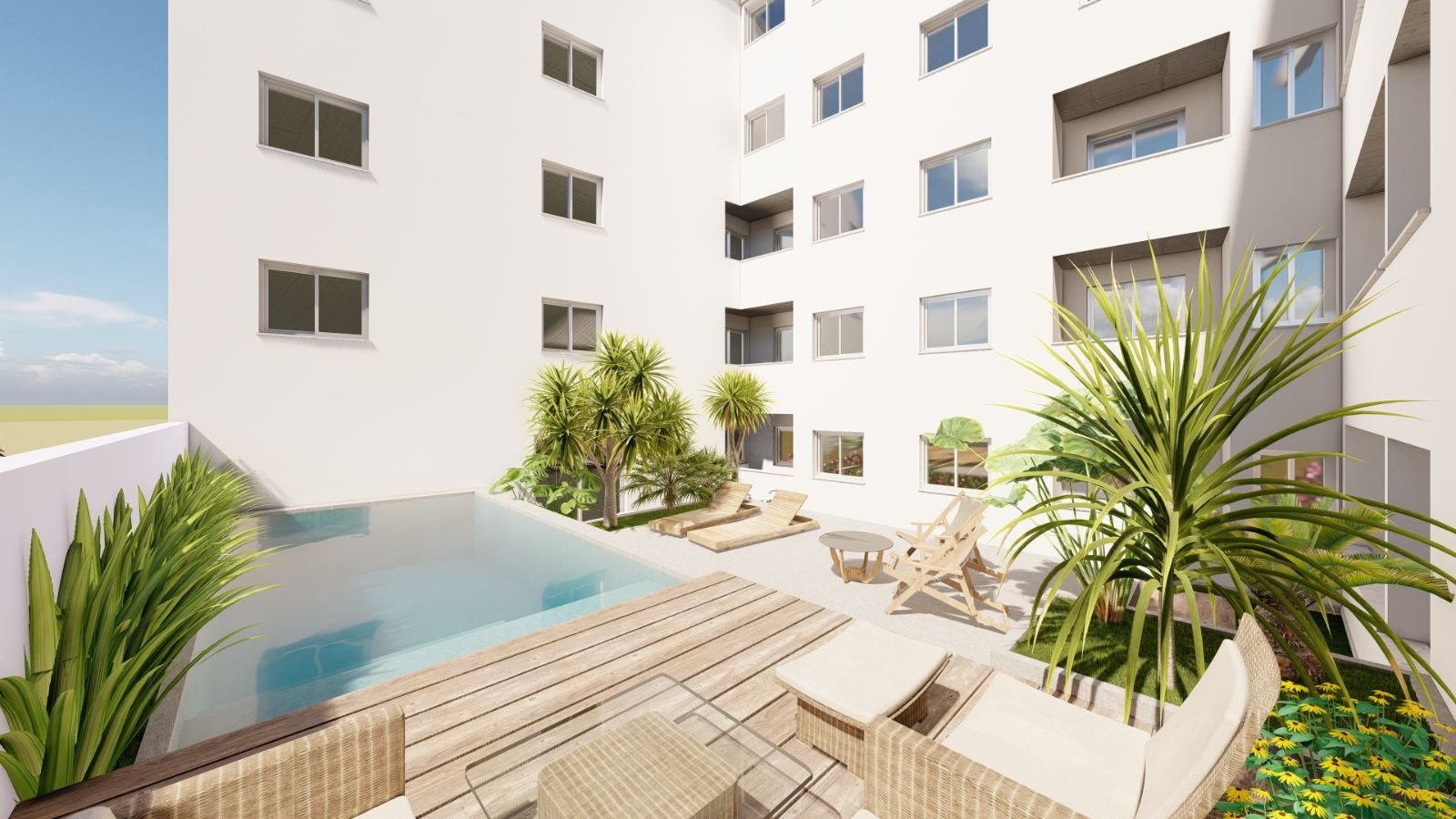 Zona verde junto a la piscina
